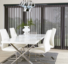 Load image into Gallery viewer, A set of elegantly designed black blinds installed on a window, with a white dining table and chairs visible in the foreground.
