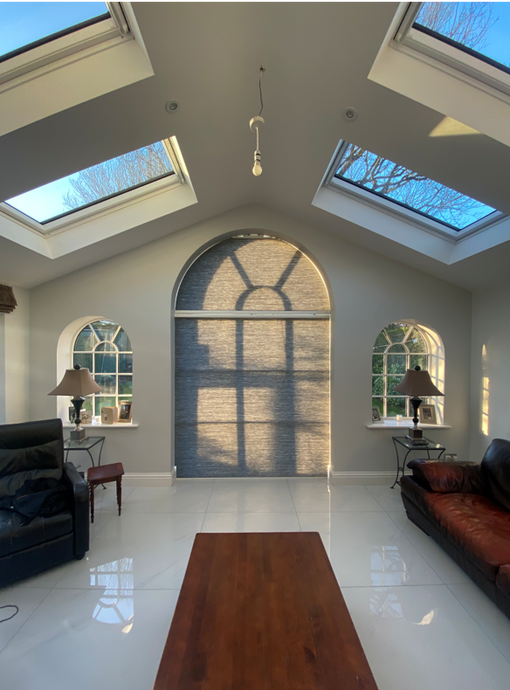 Arched Window Shading provided by Bespoke shape dim-out fabric powered by Somfy